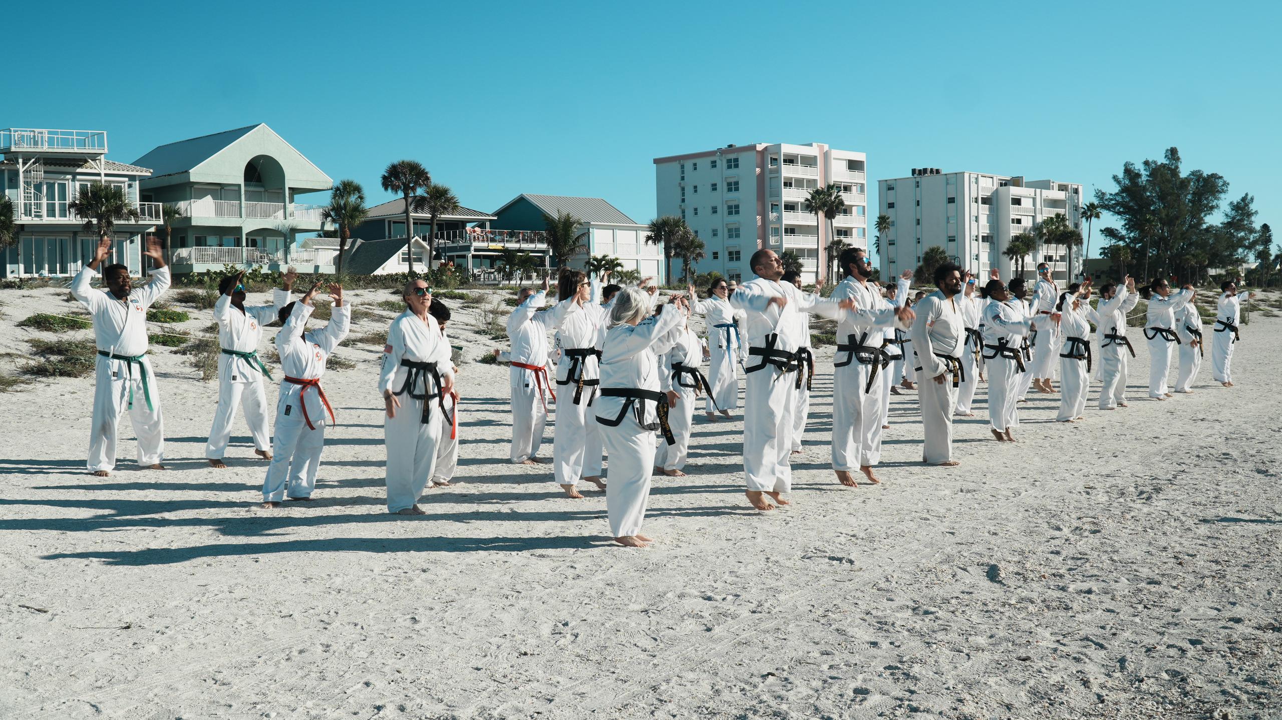 Students of every rank and age training together on the beach with Traditional TaeKwon-Do Center of South Tampa