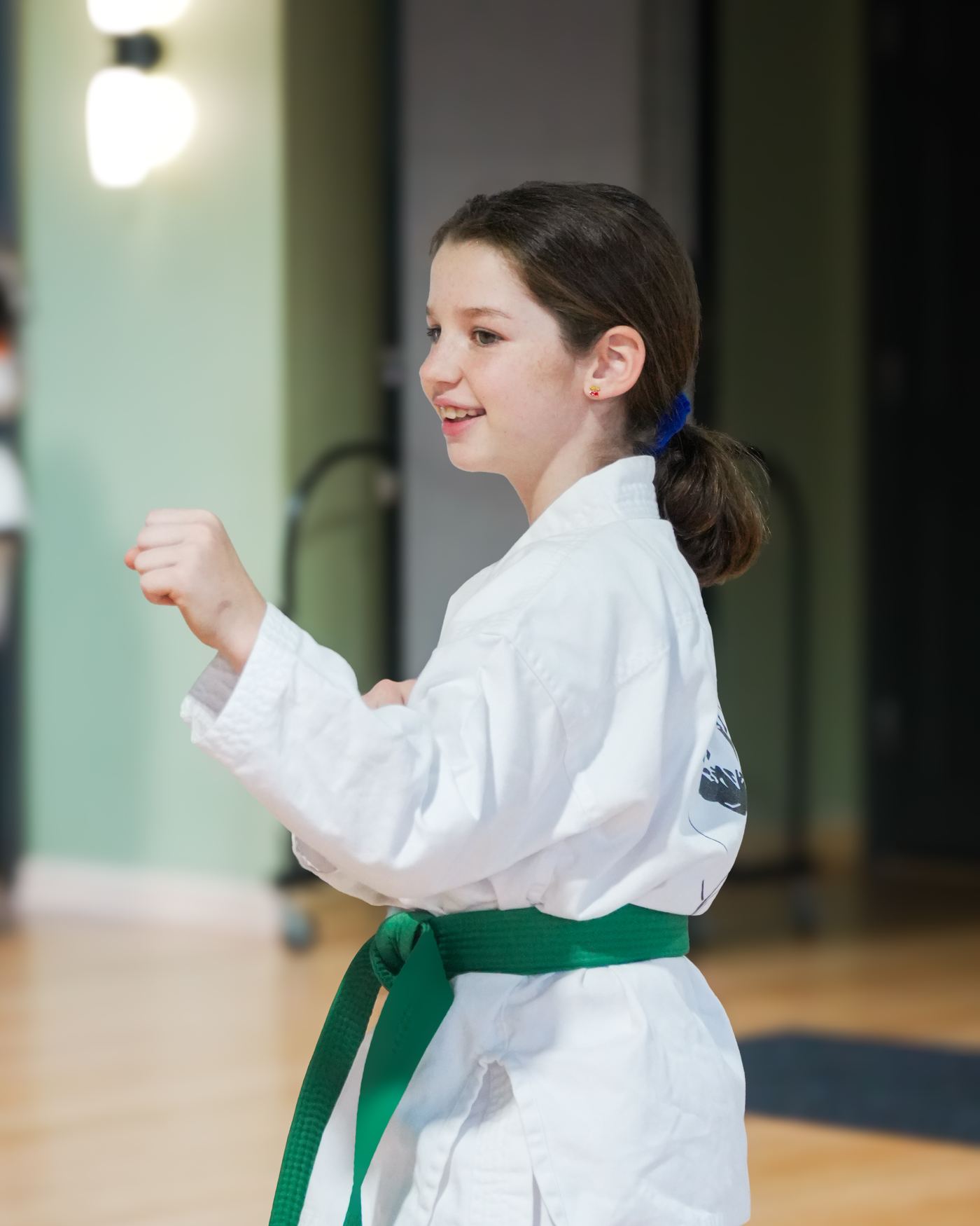 A young student holding a guard position at Traditional TaeKwon-Do Center